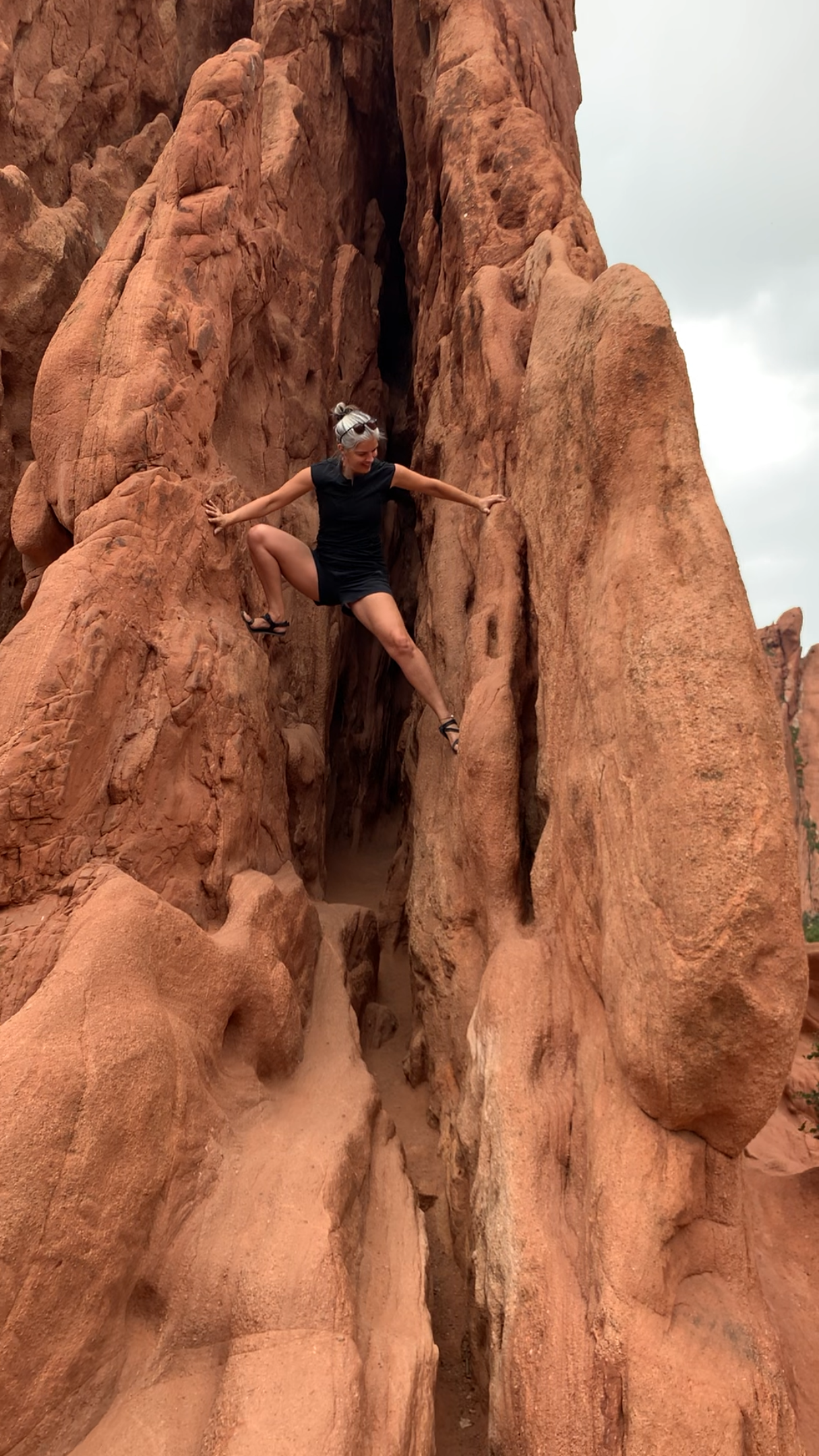 image of coach being adventurous and rock climbing